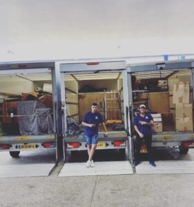 2 men outside removal vans - what is the best month to move house?